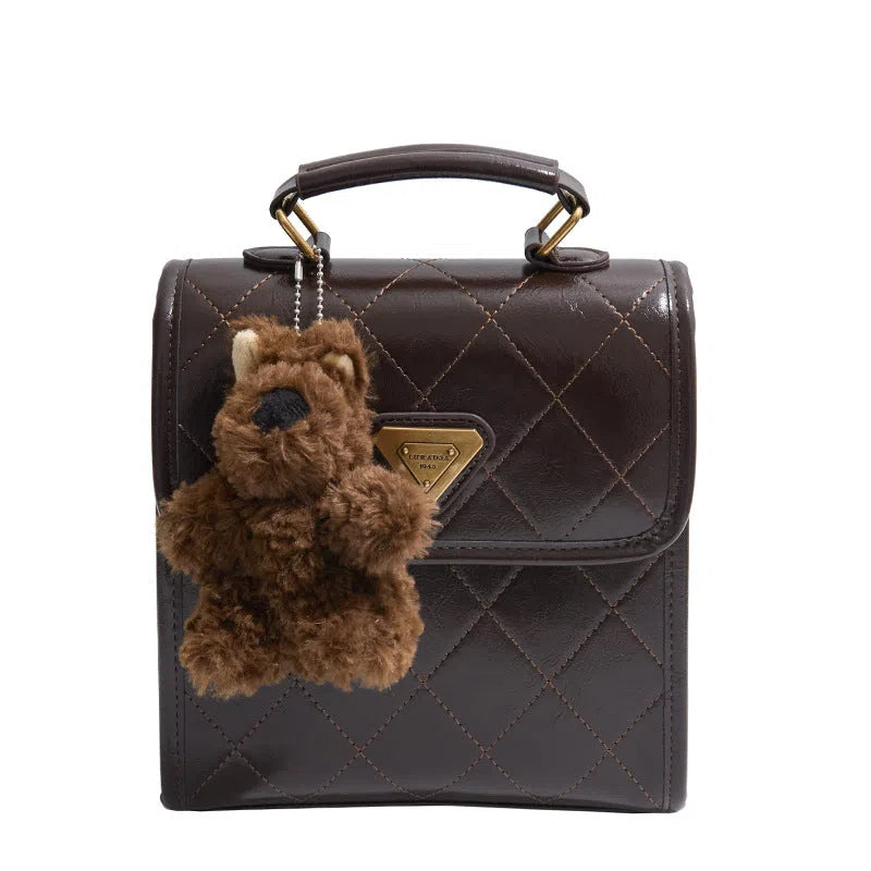 Mini PU backpack in brown with stitching design and a pendant option