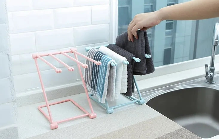 Foldable plastic dishcloth shelf in Nordic colours for kitchen bottle storage