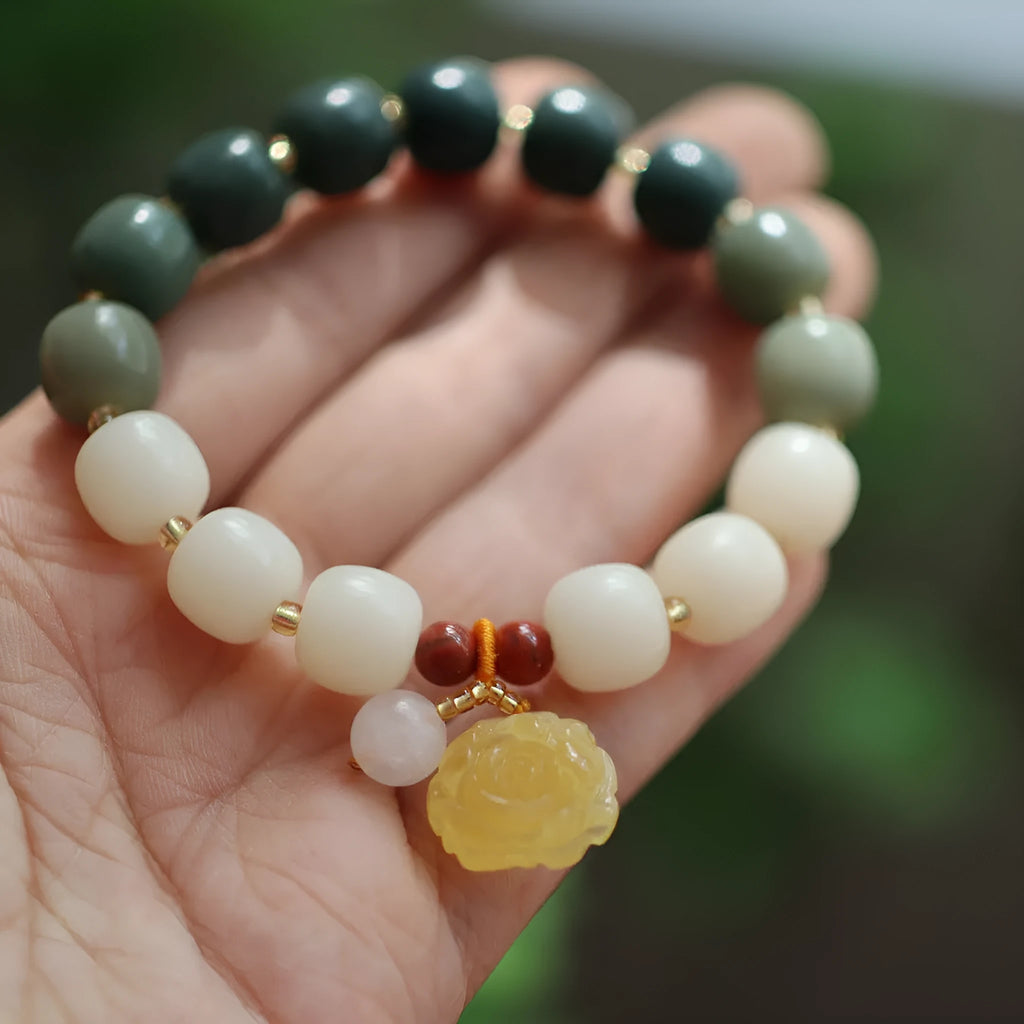 Natural bodhi root bracelet with 10mm beads in gradient white jade colour and lotus pendant