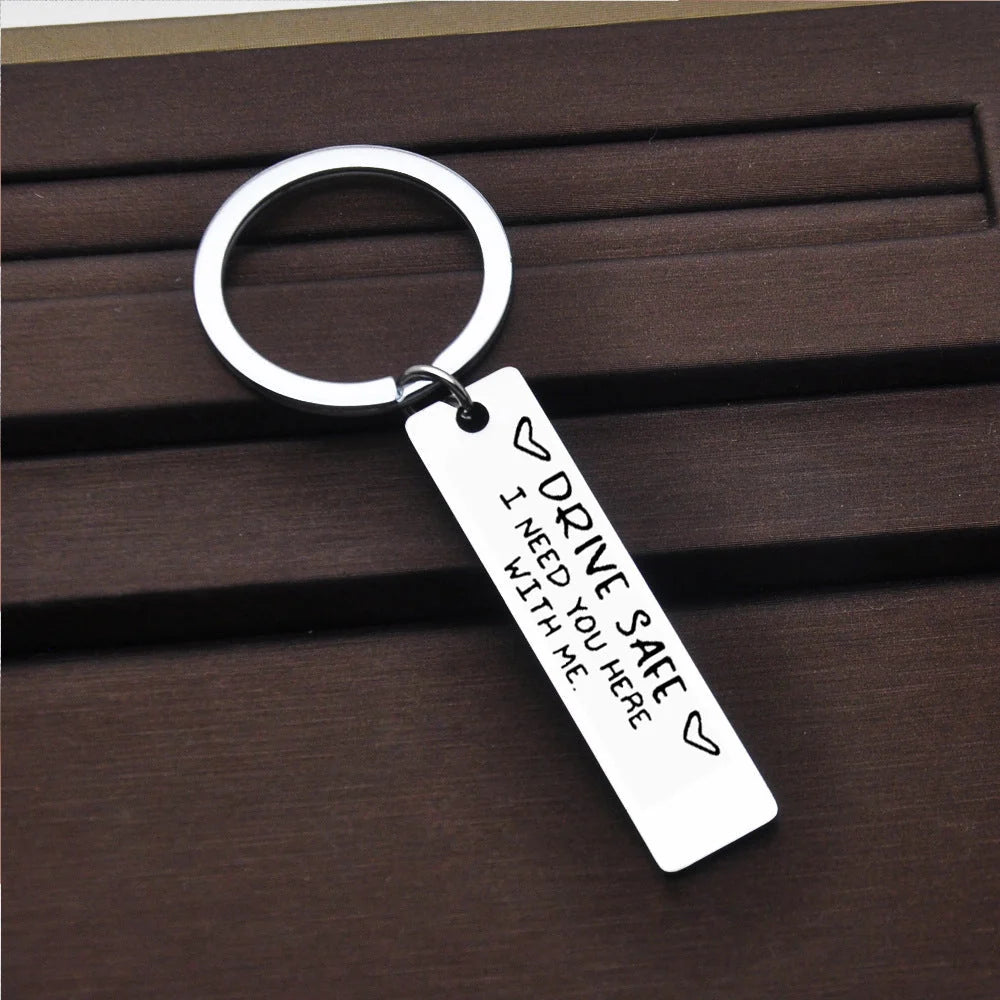 Stainless steel keychain with engraved message 'Be Safe Honey I Need You Here With Me'