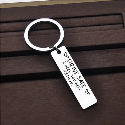 Stainless steel keychain with engraved message 'Be Safe Honey I Need You Here With Me'