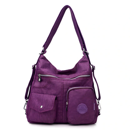 Women's waterproof nylon crossbody bag with organizational pockets and 34cm laptop capacity
