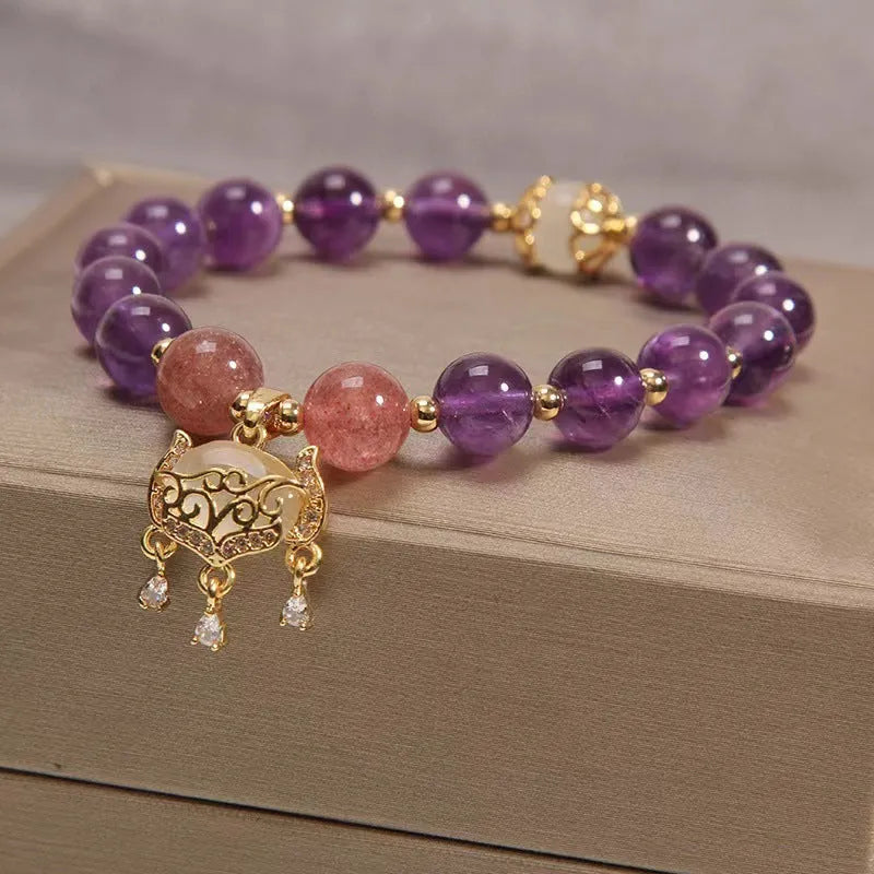 Handmade women's copper bracelet with natural amethyst crystal and gold longevity lock in retro style.