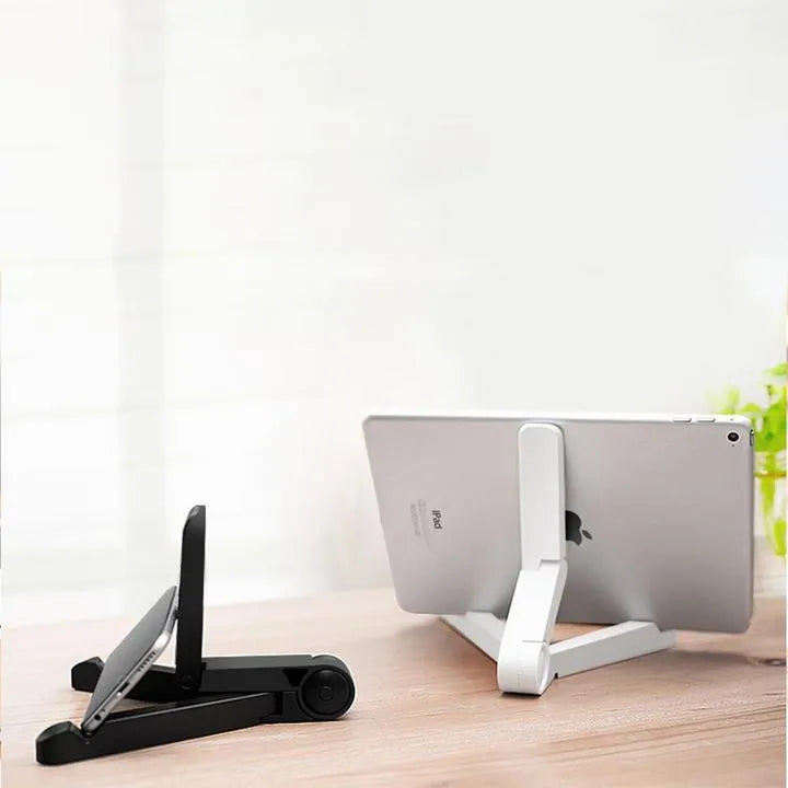 Black foldable tablet holder supporting a tablet in landscape viewing position on a desk