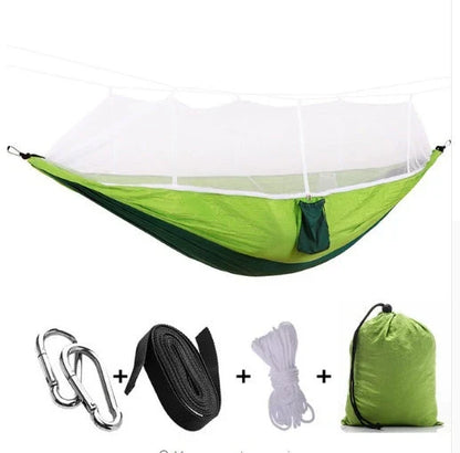 Parachute hammock with mosquito net in various colors and sizes, ideal for outdoor adventures and relaxation