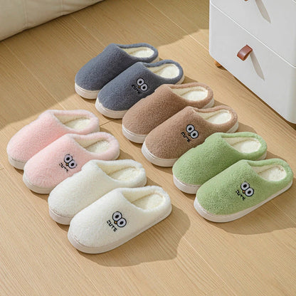 Cozy cartoon slippers with big eyes in various colors, featuring plush material and non-slip rubber soles for comfortable indoor wear