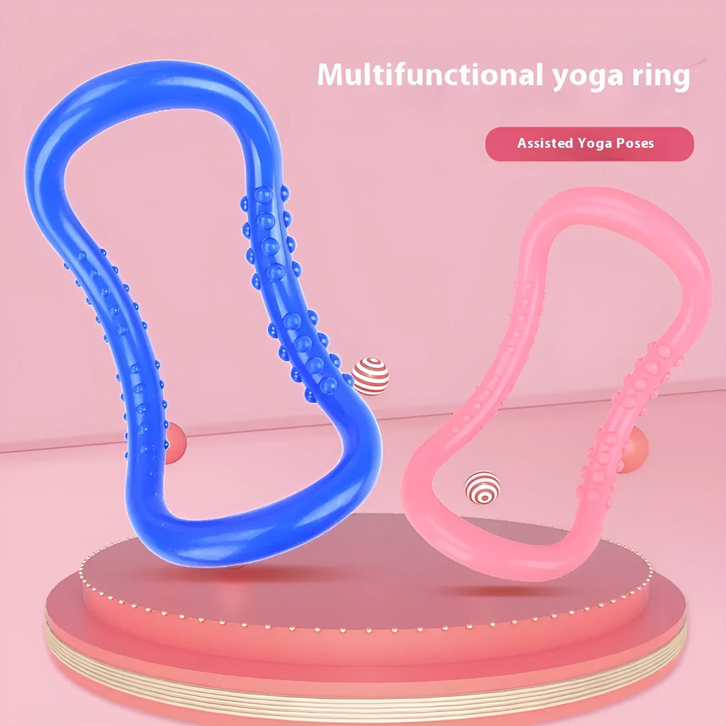 A purple yoga stretching ring made of plastic on a plain background.