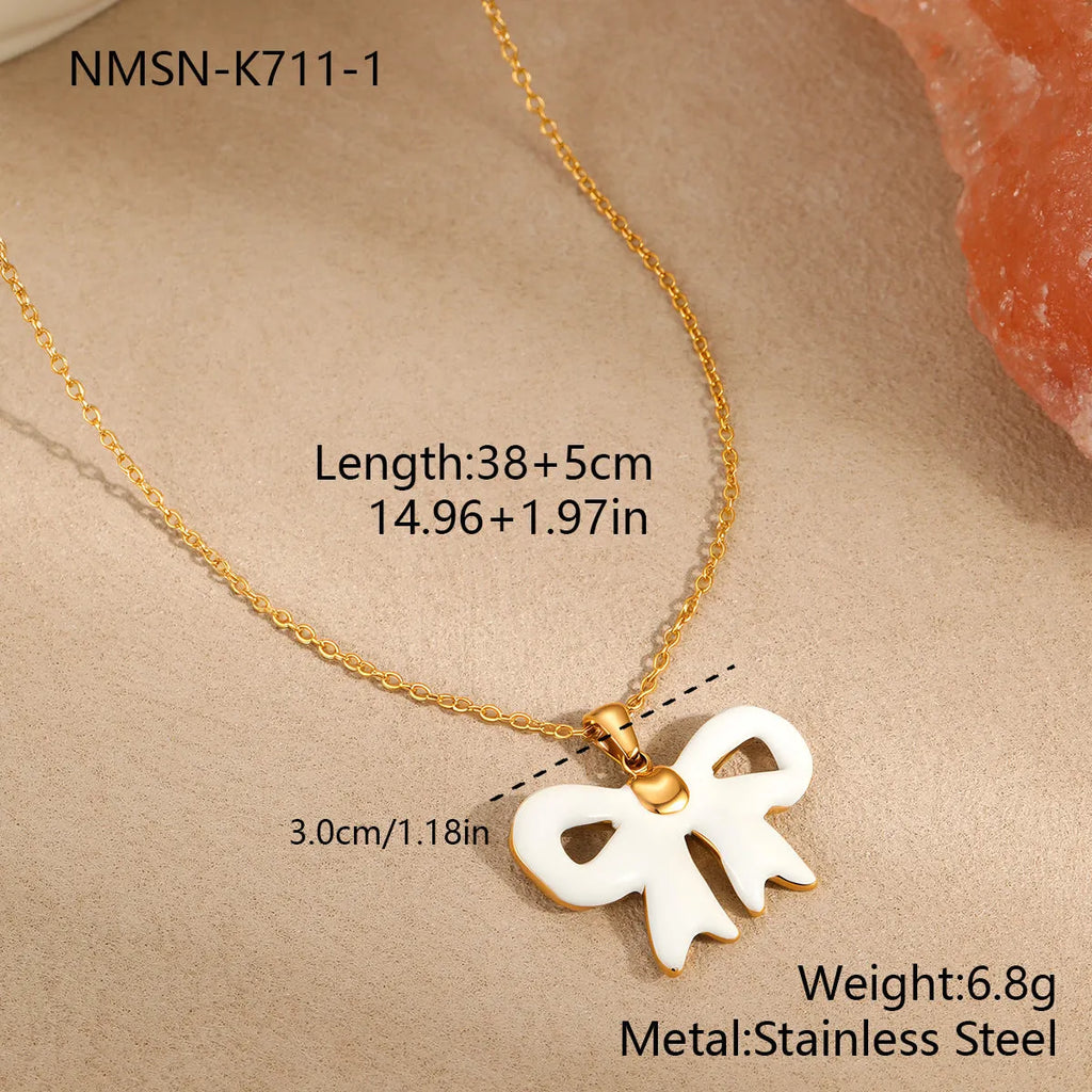 Bowknot stainless steel pendant necklace on white background, adjustable 41-50cm chain, 18K gold-tone finish