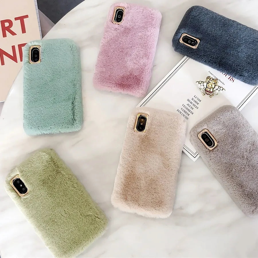 A soft apricot-coloured silicone rabbit plush phone case for an iPhone, showing the raised camera circle and side buttons.