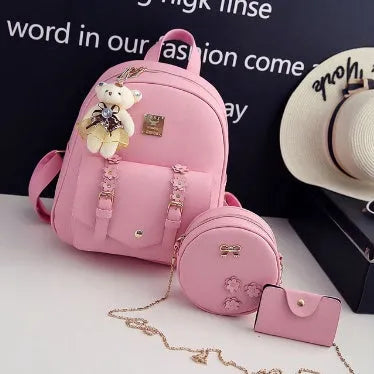 Women's three-piece floral PU leather bag set showing backpack, crossbody shoulder bag, and card holder