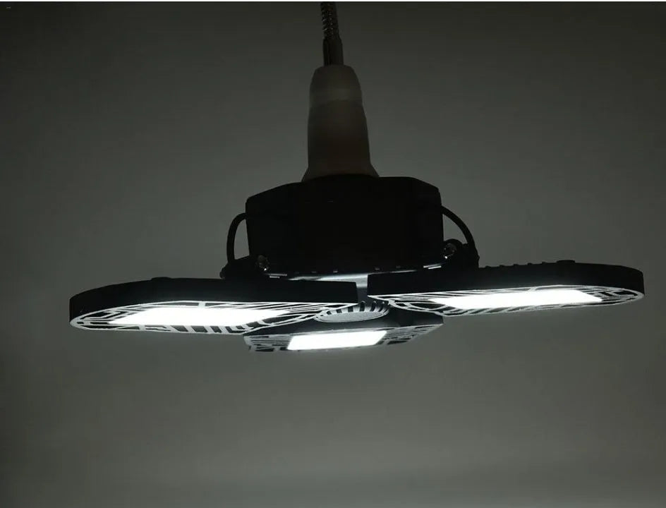 60W deformable LED garage light with three adjustable aluminium alloy heads on a white background