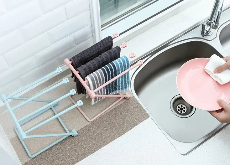 Foldable plastic dishcloth shelf in Nordic colours for kitchen bottle storage