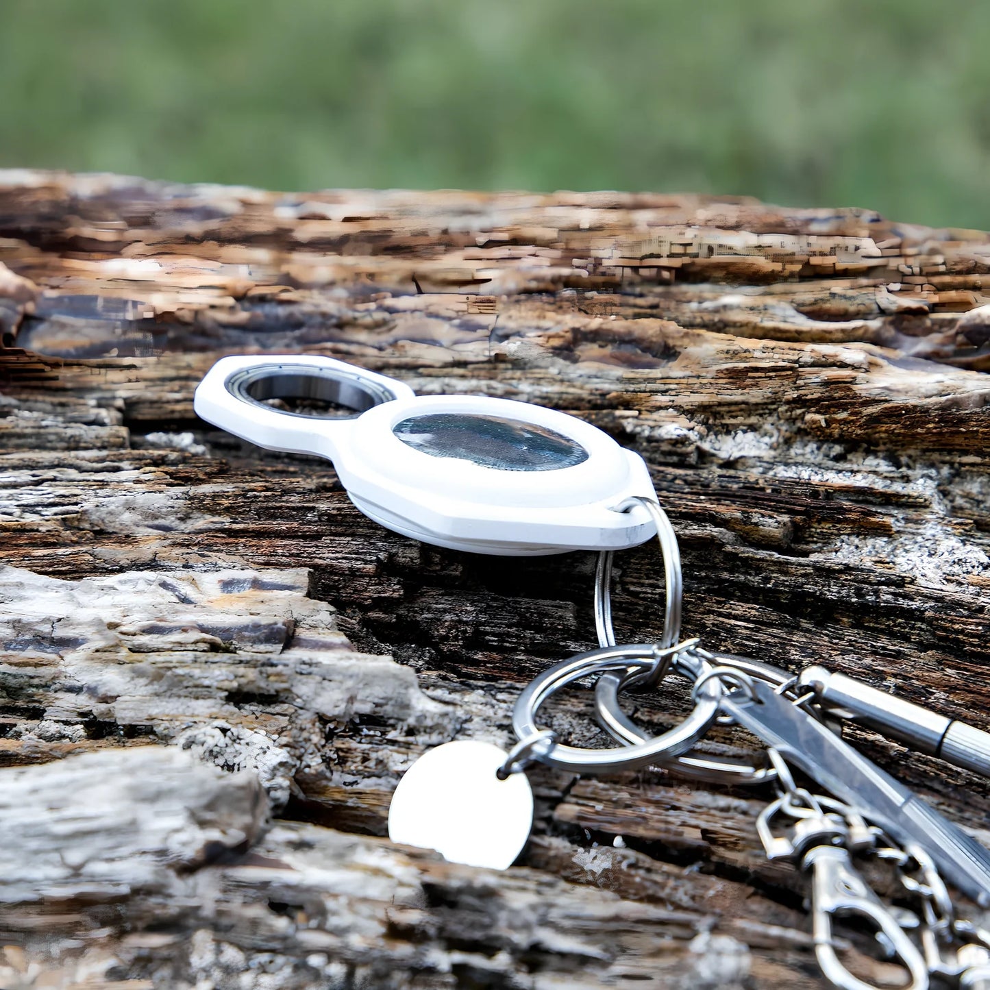 White zinc alloy Apple AirTag keychain case with protective cover and swivel keyring