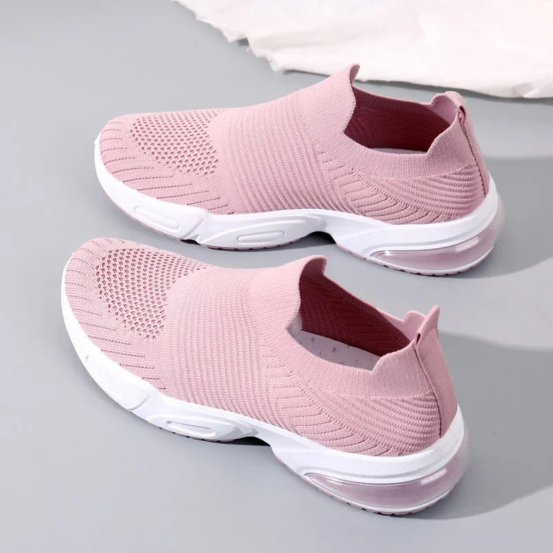 Slip-on breathable sock shoe in a low-top design with a mesh upper and PVC sole.