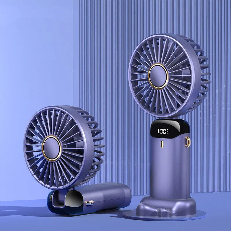 Blue portable electric fan folded at 190-degree angle showing handheld grip, desk base, and neck lanyard attachment