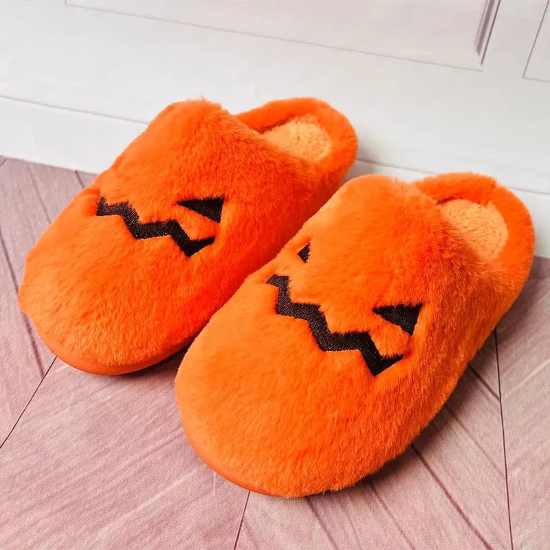 Orange Halloween pumpkin slippers with plush interior and non-slip PVC sole