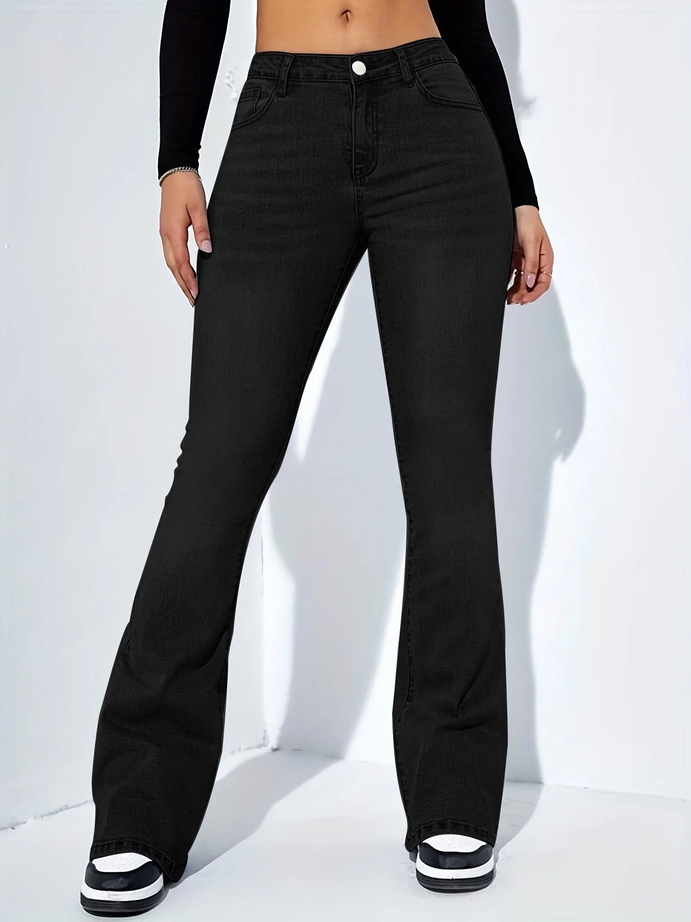 Women's slim-fit flared jeans in high waist stretch cotton, available in blue, light blue, and black.