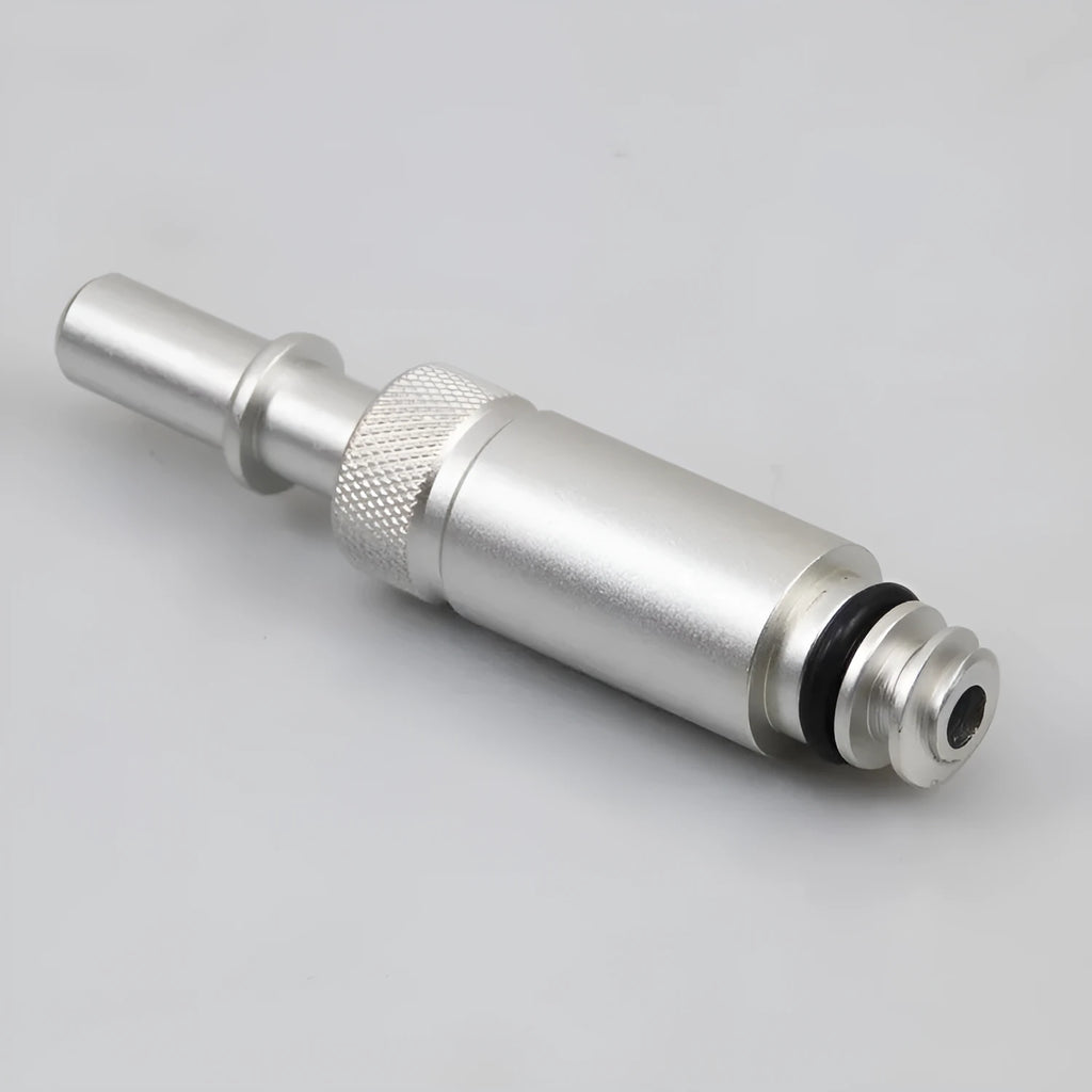 Silver metal VAS6262-9 transmission oil refueling adapter tool on a workshop bench.