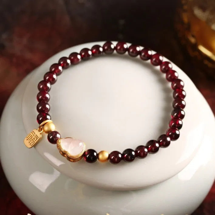 Chinese style gourd bracelet with imitation garnet beads and traditional Fu character charm on adjustable U-shaped design
