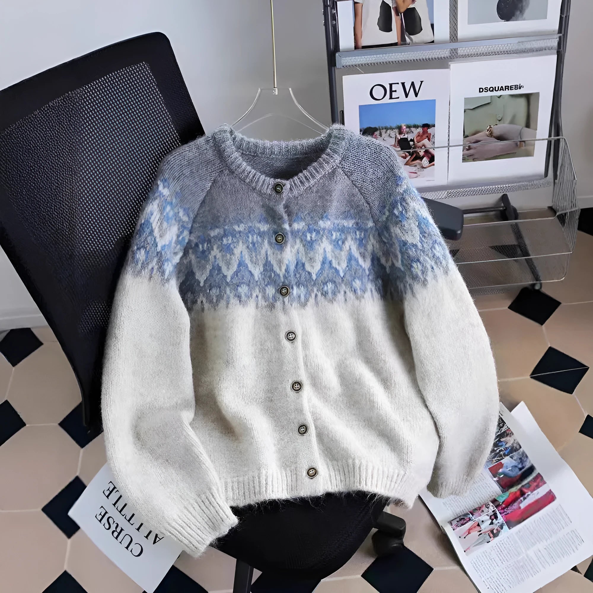 Women's loose beige jacquard knit coat sweater with long sleeves on a hanger