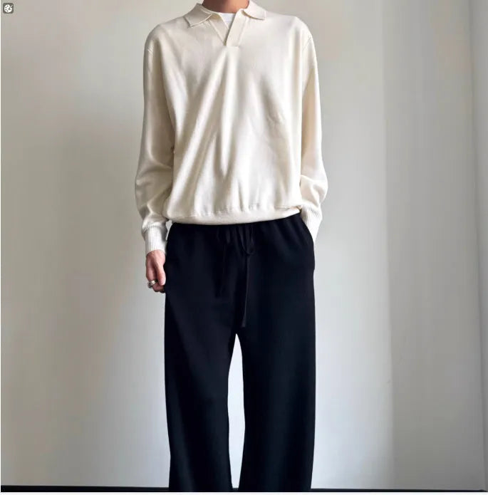 Pure wool polo sweater with a lapel collar in milky white, showing loose fit and long sleeves.