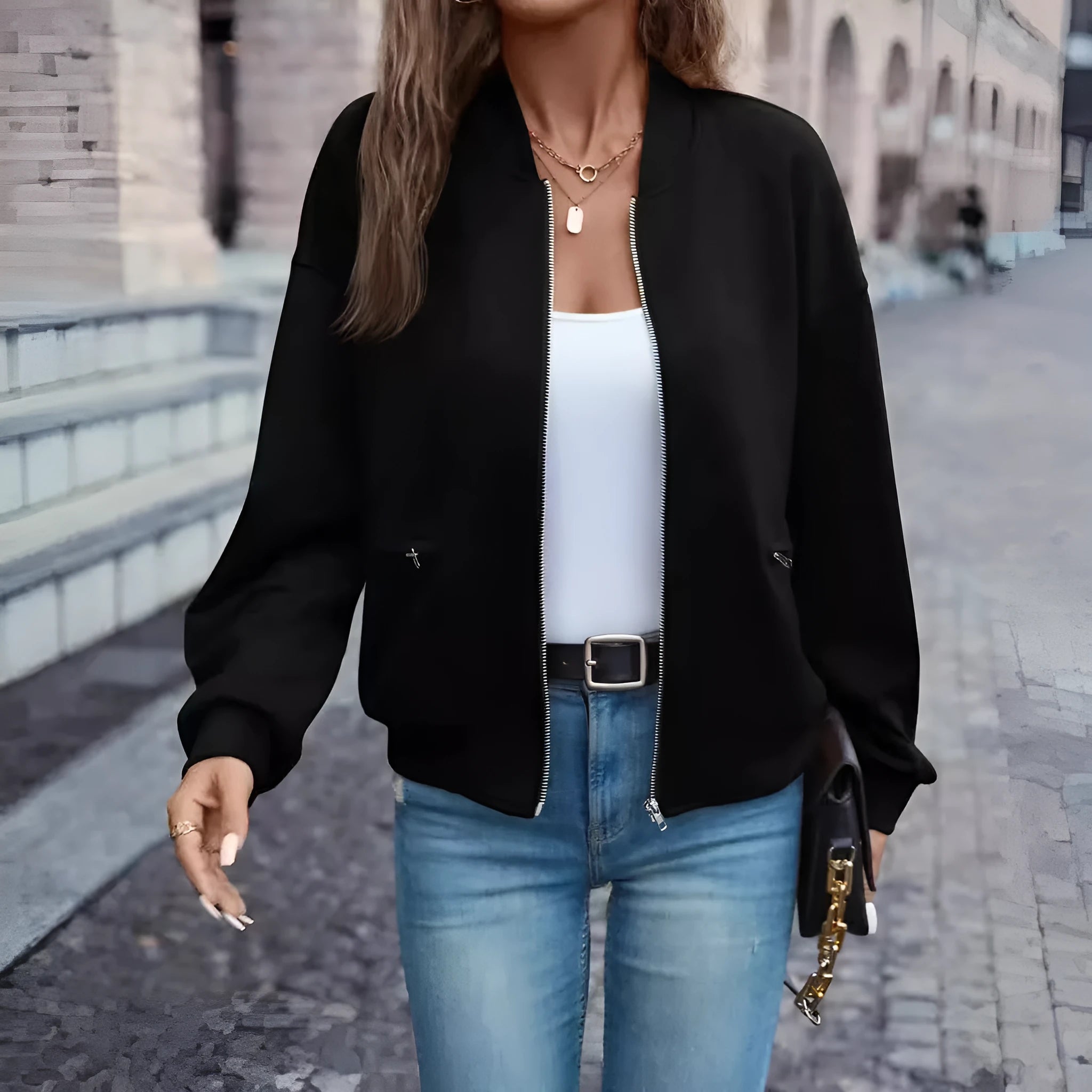 Solid black women's zip jacket with long sleeves and faux pocket details on front.