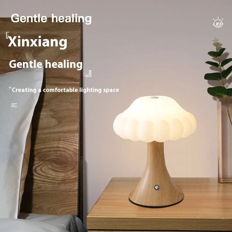 Wooden grain finish mushroom-shaped touch control night lamp on a table
