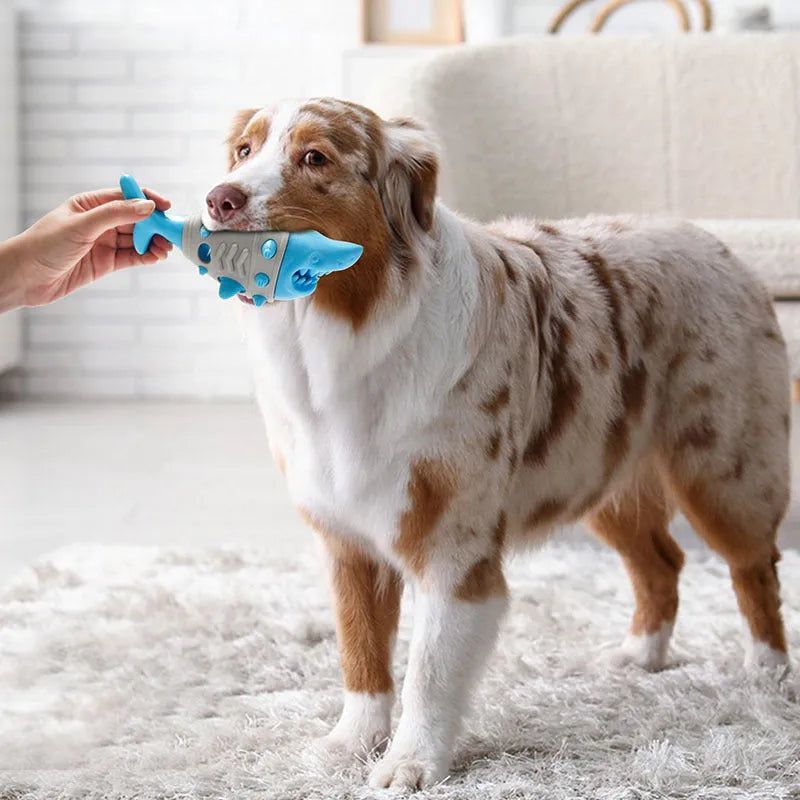 Blue dog teething toy with shark-tooth textured surface and visible air vents for bite-resistant chewing