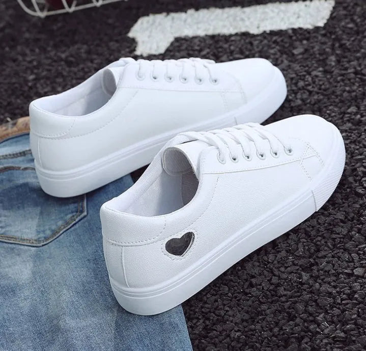 Women's PU leather heart pattern flat shoes in white red colour with non-slip rubber sole