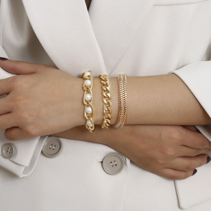 Creative Chain Inlaid Pearl Bracelet in gold, featuring imitation pearls and a modern chain design