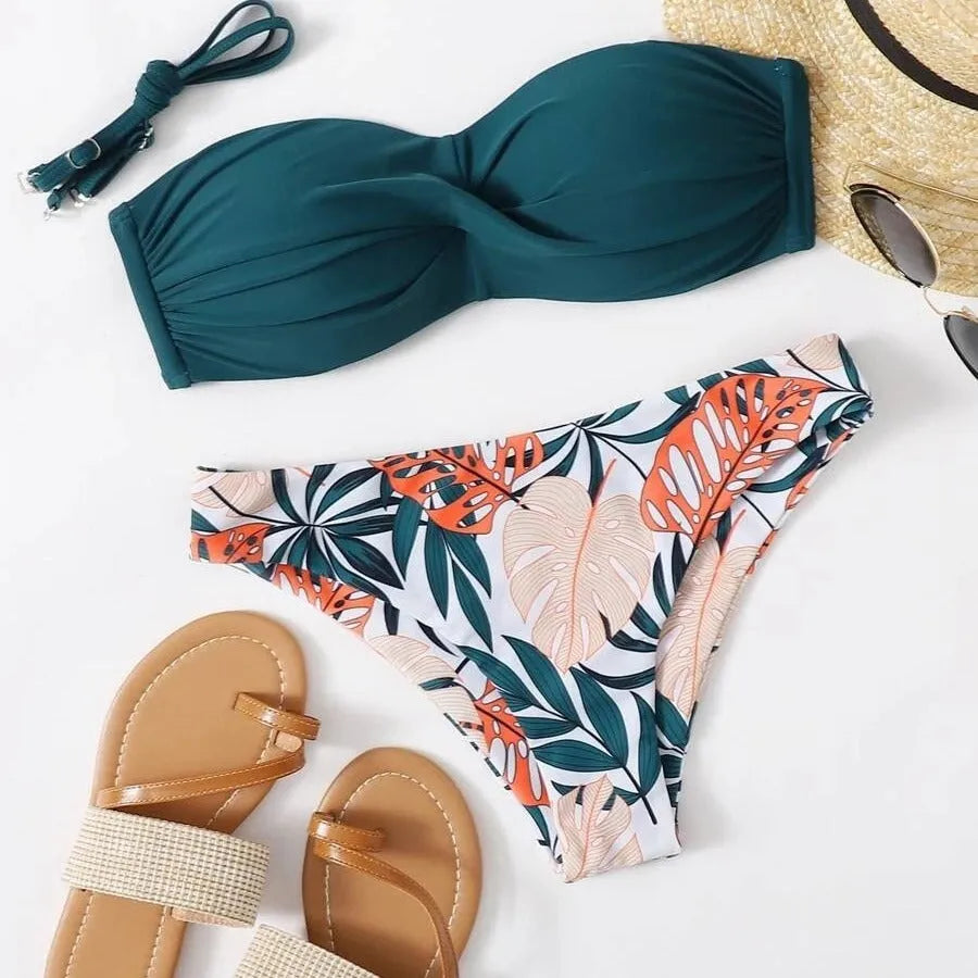 Split push up bikini swimsuit set in green on a mannequin, showing top and briefs style.