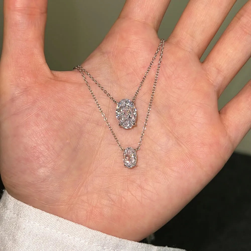 S925 sterling silver necklace with an oval ice flower geometry pendant in gold or platinum finish.