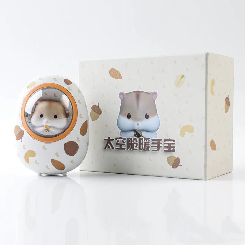 White Hamster brand hand warmer and power bank with 5000mAh capacity on a plain background.