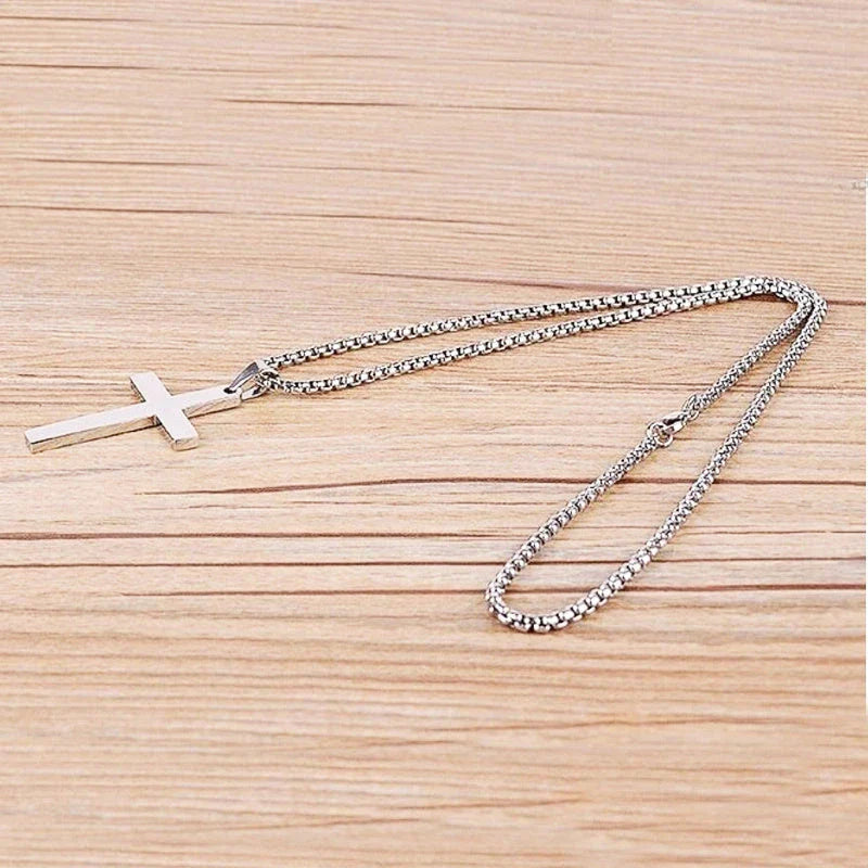 Stainless steel cross pendant necklace for men, available in black, silver, and gold finishes