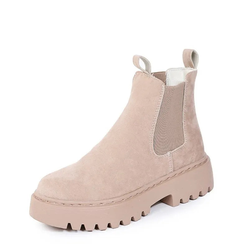 Women's Martin boots in solid colour with chunky platform sole, flat heel, and leather stitching