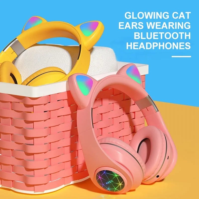 Cat ear design wireless Bluetooth headphones shown in multiple colours including pink, black, and blue.
