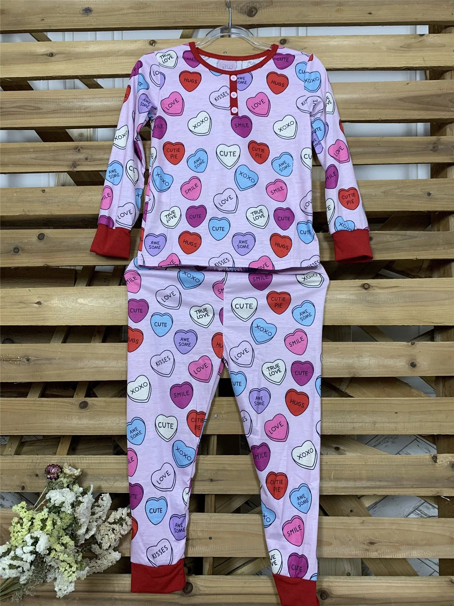 Valentines Day family pajamas with a cozy heart print design for parents and children