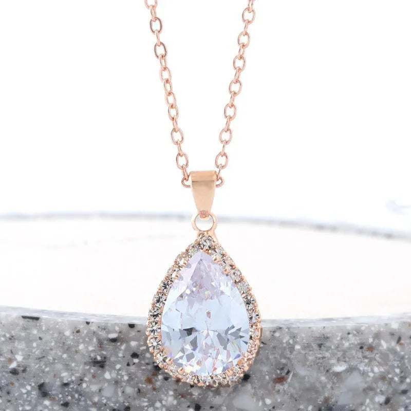 Women's alloy drop necklace with geometric rhinestone pattern in pink rose gold colour