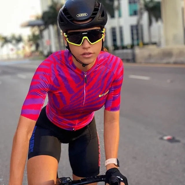 Attaquer women's sleeveless cycling jersey and matching bib shorts set shown in one of five available colourways.