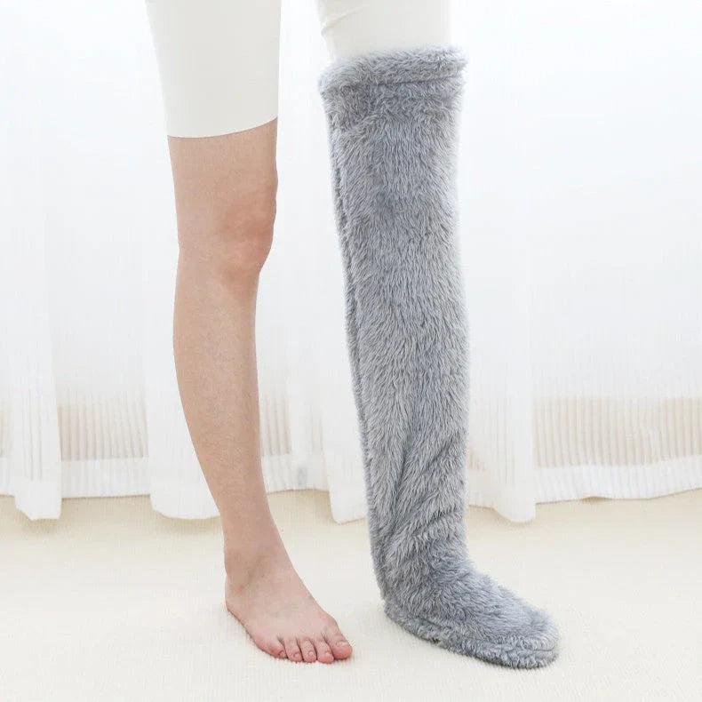 Cozy over-the-knee fuzzy socks in various colors, designed to keep your legs and knees warm during the winter season.