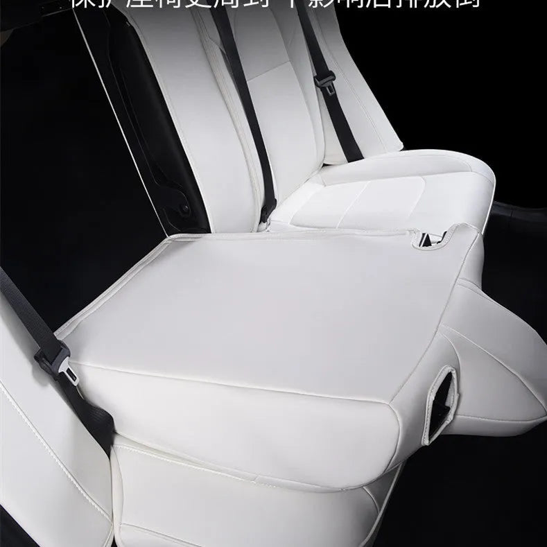 Black PVC chloroprene car seat cover fitted on a Tesla Model 3 front seat.