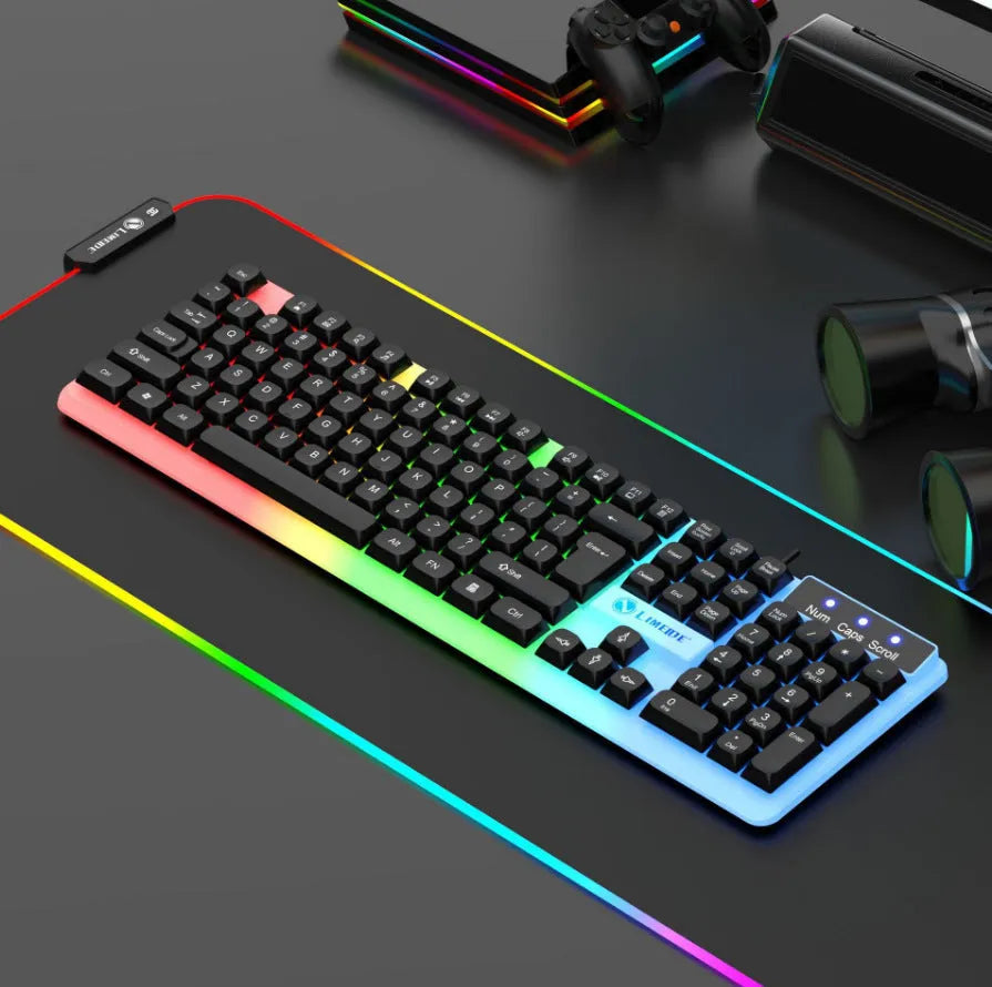 TX35 mechanical feeling keyboard in white and black rainbow colour options next to a laptop.
