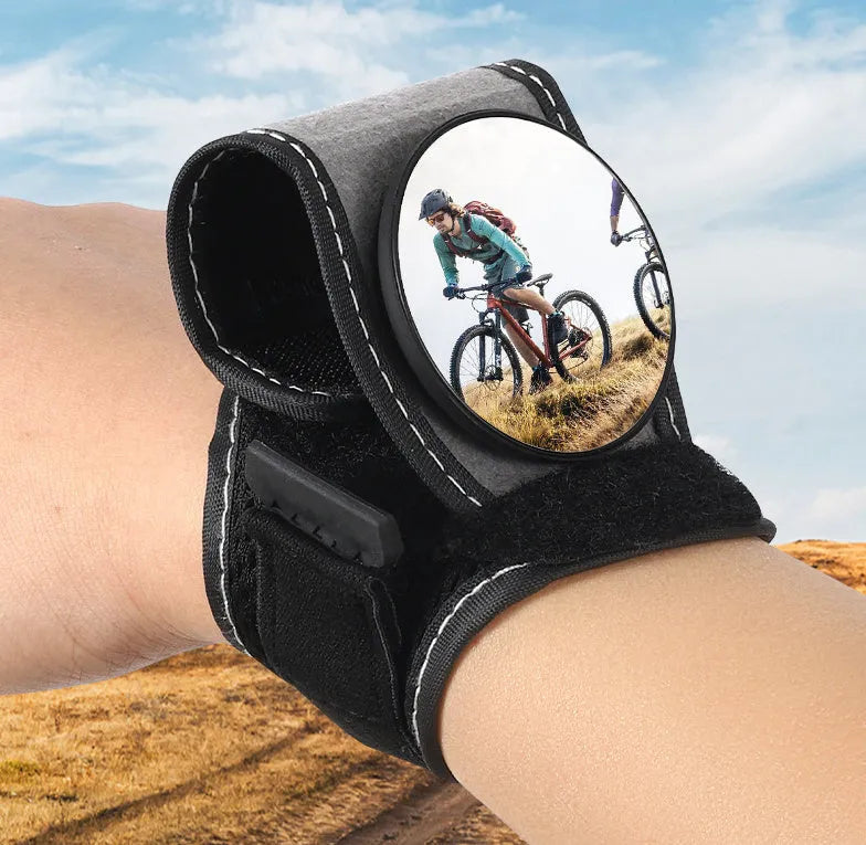 Black nylon bicycle rear-view mirror showing wrist mounting and adjustable viewing mechanism