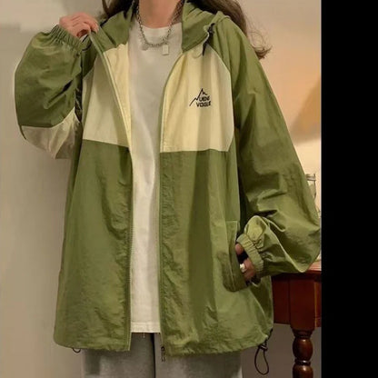 Women's summer sun protection top with raglan sleeves in apricot colour showing loose fit and splicing details