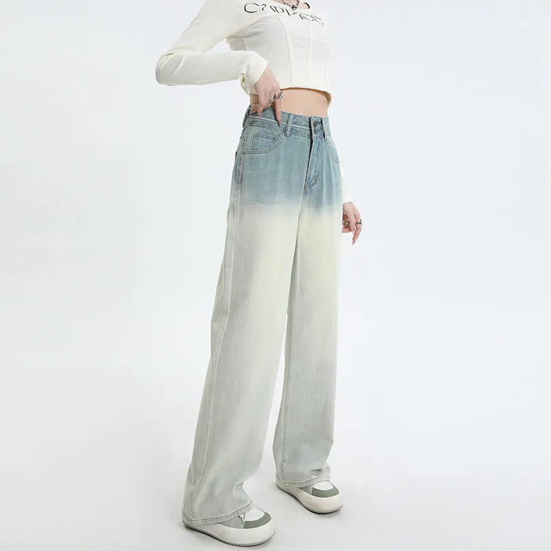 Women's gradient blue straight-leg wide leg cotton denim trousers laid flat.
