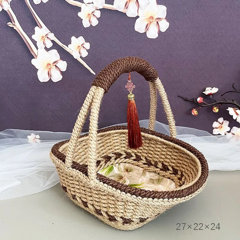 Coffee brown straw basket with hand-woven hemp rope detailing, shown on a wooden table.