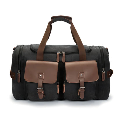 Medium canvas travel bag in black, 53x31x24cm with zipper top, double padded straps, waterproof canvas for 20-35L storage