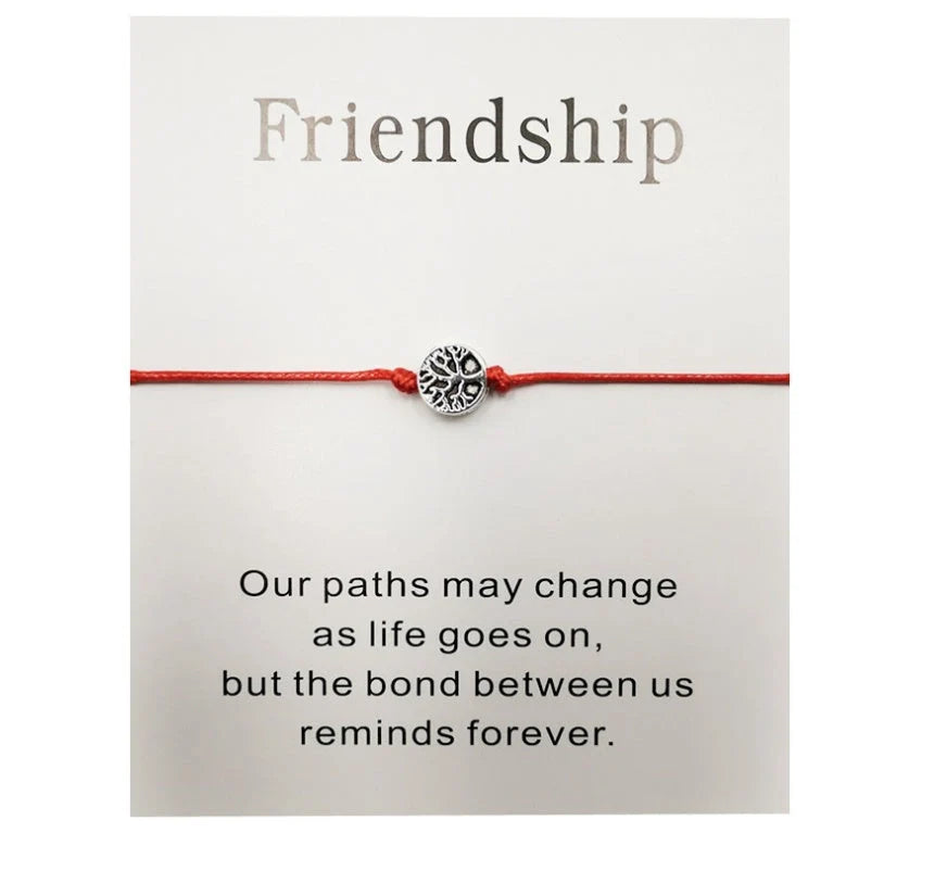 Hand-woven red rope Tree of Life bracelet with adjustable sizing