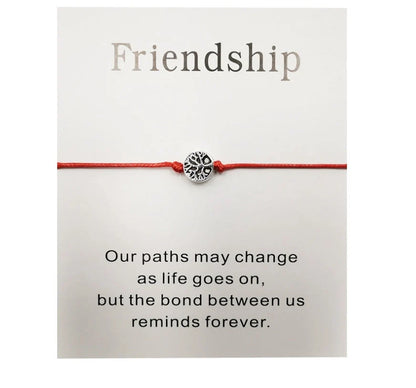 Hand-woven red rope Tree of Life bracelet with adjustable sizing