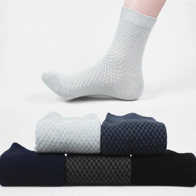 A pair of men's bamboo fibre ankle socks with a small square pattern, shown in one of the five available colours.